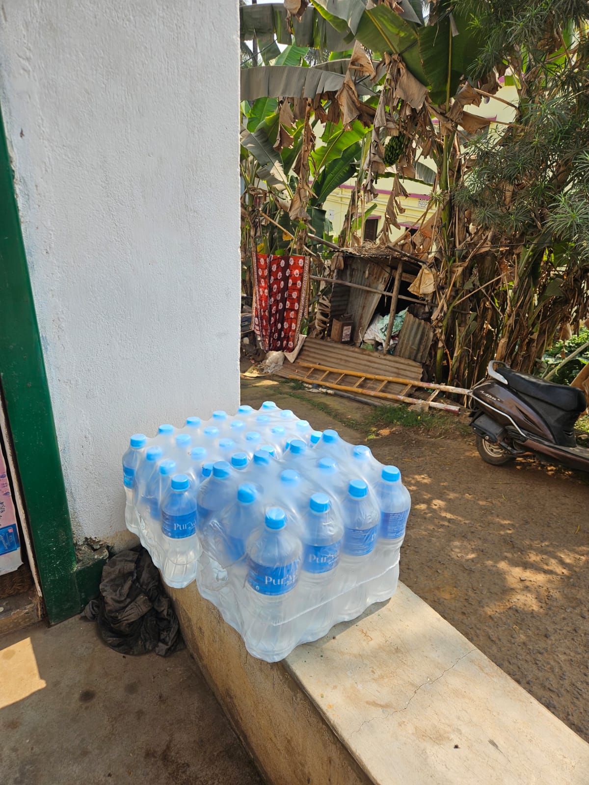 Puriva Water bottles at sunset by the waterside
